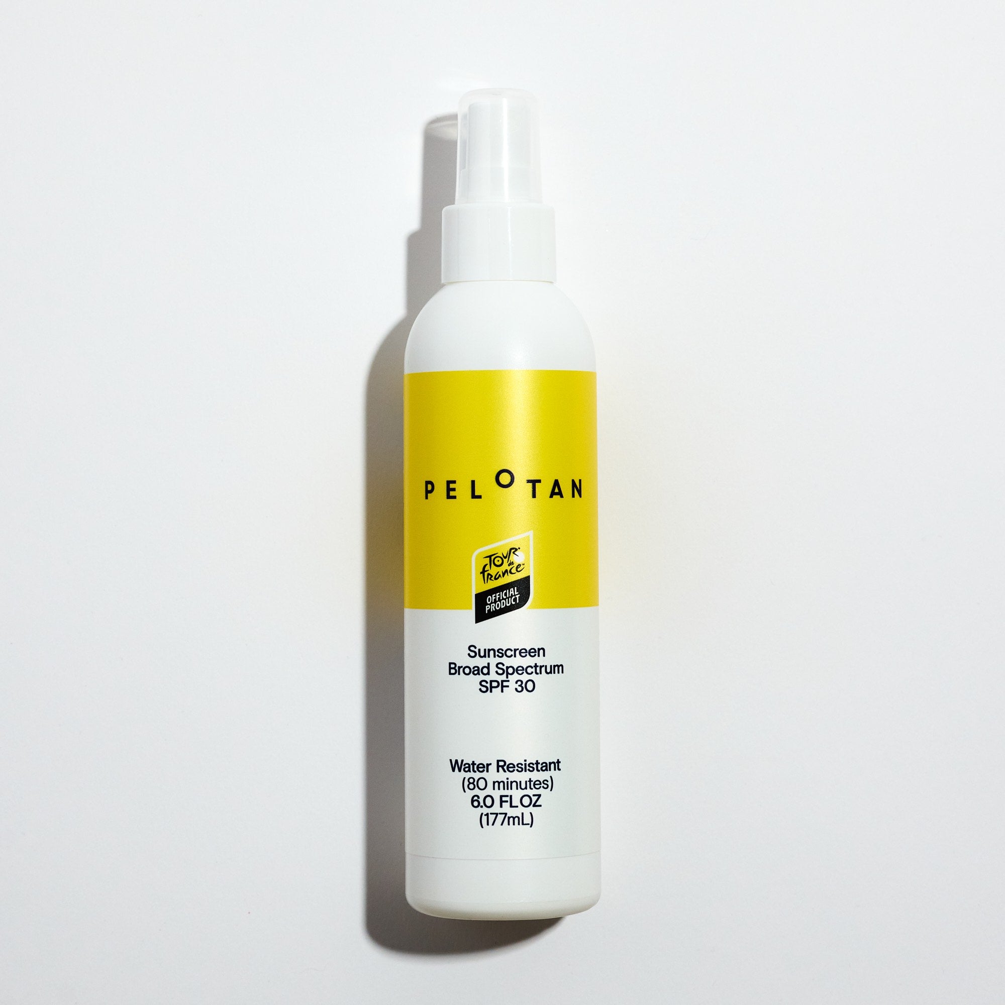 Pelotan spray bottle with yellow label on a light gray background. Official product of the tour de france.
