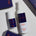 Two bottles of Peloton sunscreen on a light surface with boxes in the background.
