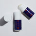 Two bottles of Pelotan roll-on product on a white background