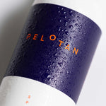Pelotan bottle with water droplets on a white background