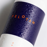 Pelotan bottle with water droplets on a white background