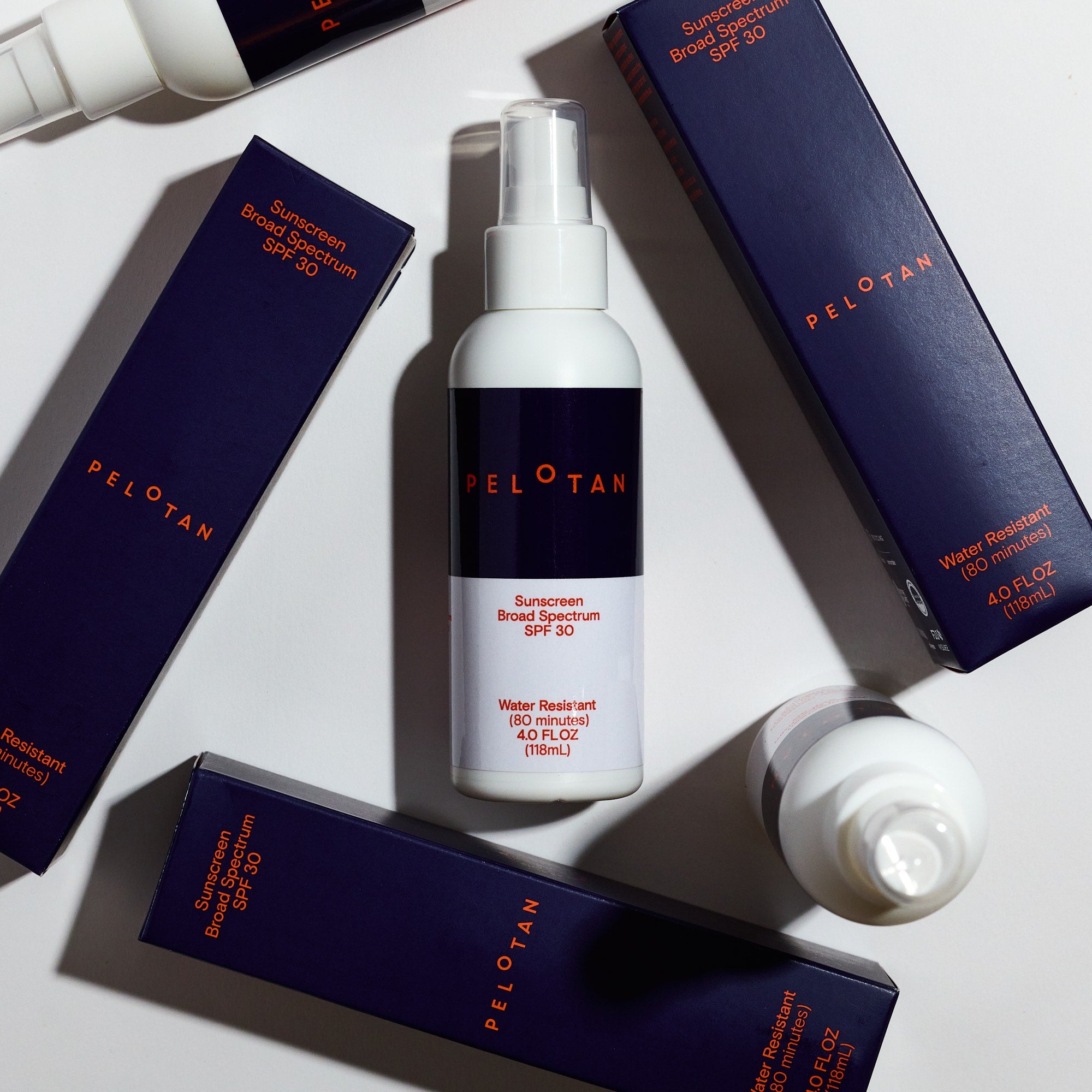 PELOTAN sunscreen bottle and boxes on a light gray background