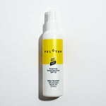 Pelotan spray bottle with yellow label on a light gray background. Official product of the tour de france.