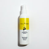 Pelotan spray bottle with yellow label on a light gray background. Official product of the tour de france.