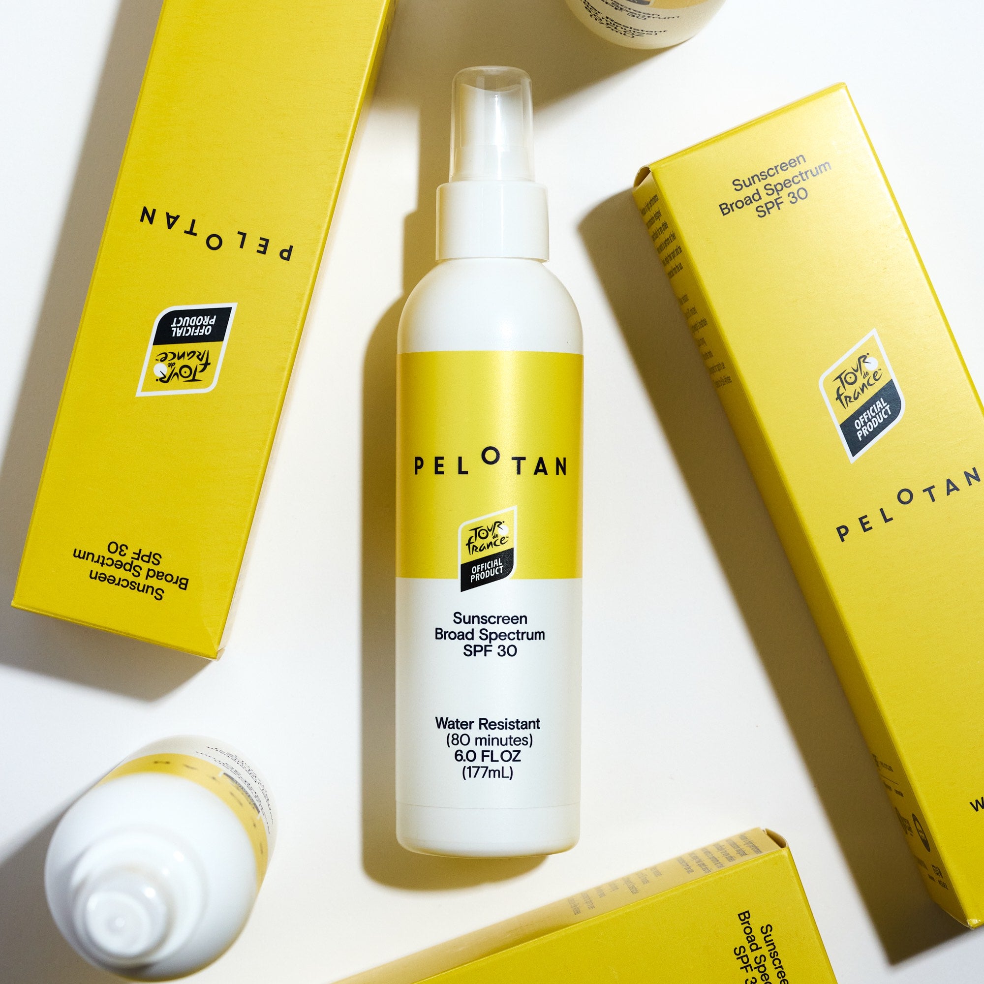 Pelotan sunscreen spray bottle with yellow boxes on a white background