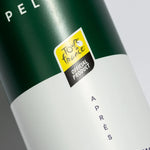 A closeup of the Pelotan Apres recovery balm bottle, showing that this is a special edition with the Tour de France.