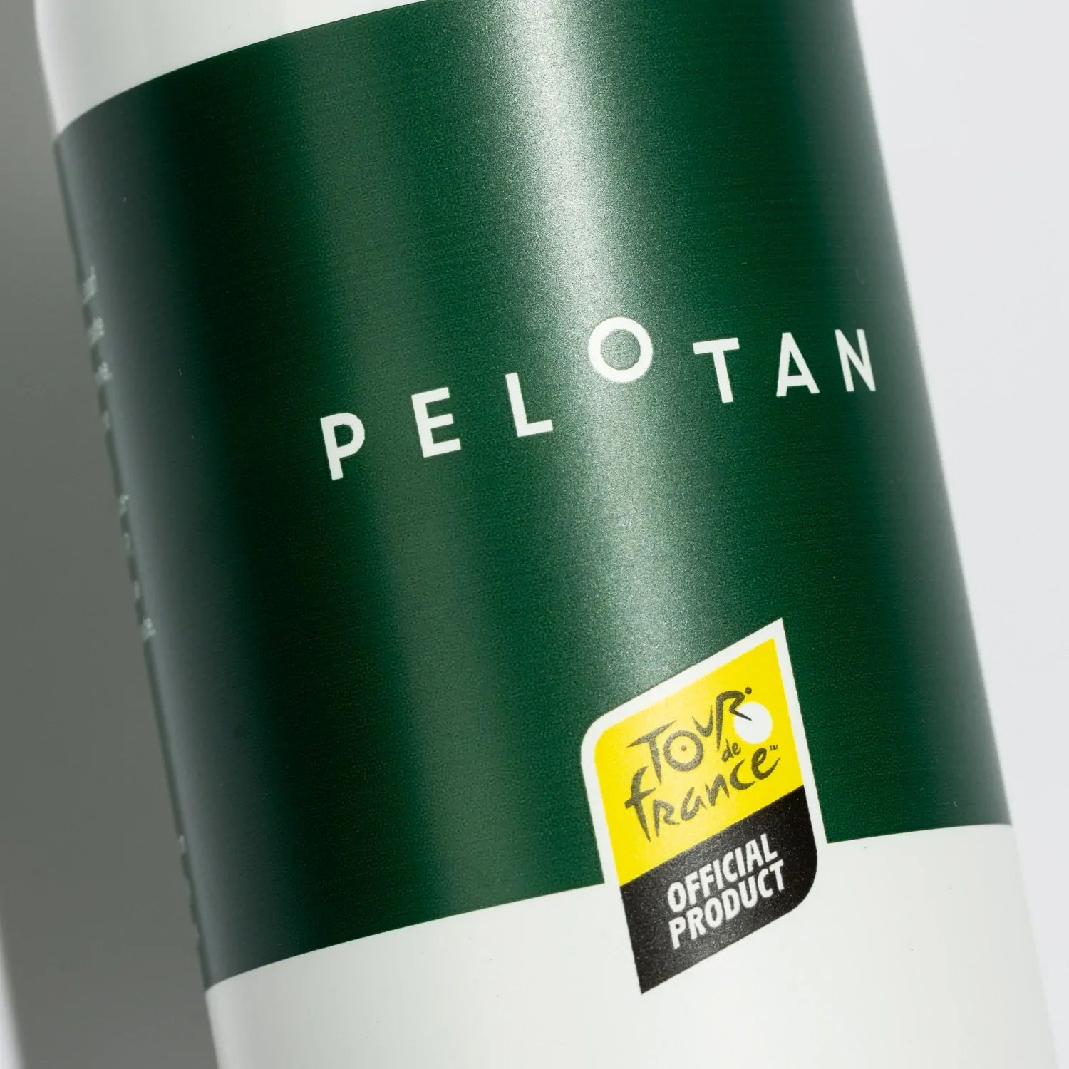 A closeup of the Pelotan Apres recovery balm bottle, showing that this is a special edition with the Tour de France.