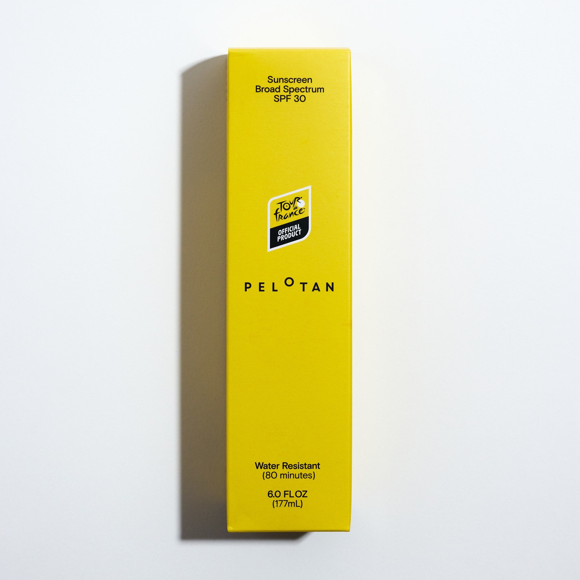 Yellow box of Peloton sunscreen with SPF 30 on a white background
