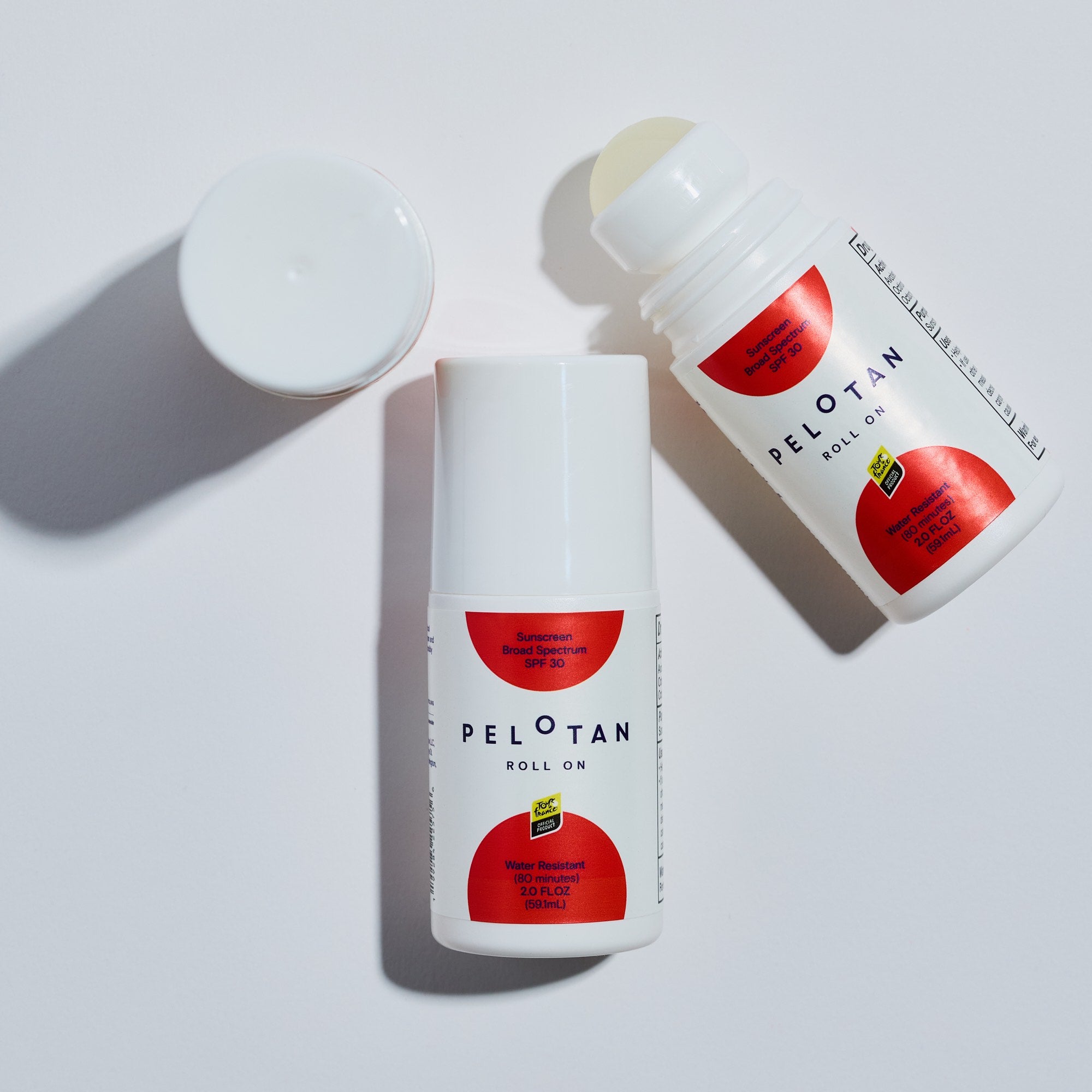 Two bottles of Pelotan roll-on product on a white background