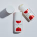 Two bottles of Pelotan roll-on product on a white background