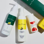 Three Pelotan sunscreen products on a white background